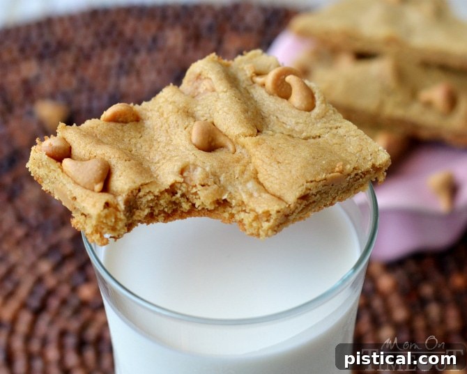 Close-up of freshly baked Double Trouble Peanut Butter Cookie Bars, showing their chewy texture.