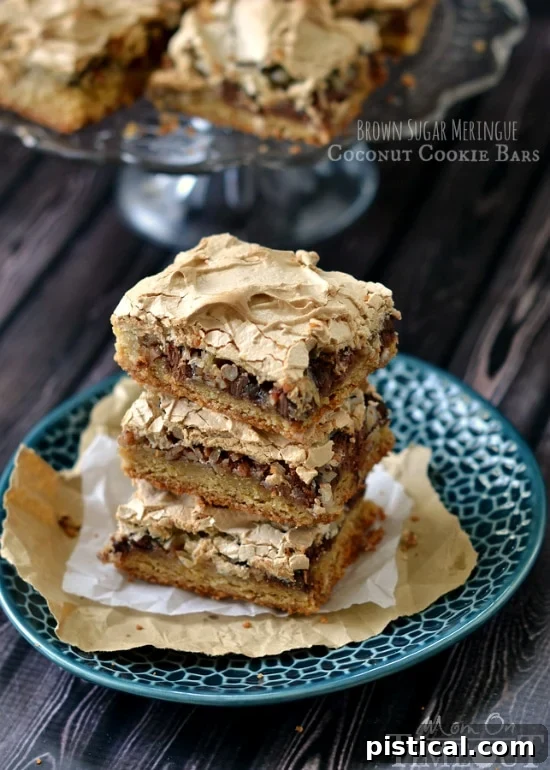 Glorious Brown Sugar Meringue Coconut Cookie Bars: A decadent dessert with a rich cookie base, sweet coconut, chocolate chips, and a golden meringue topping.