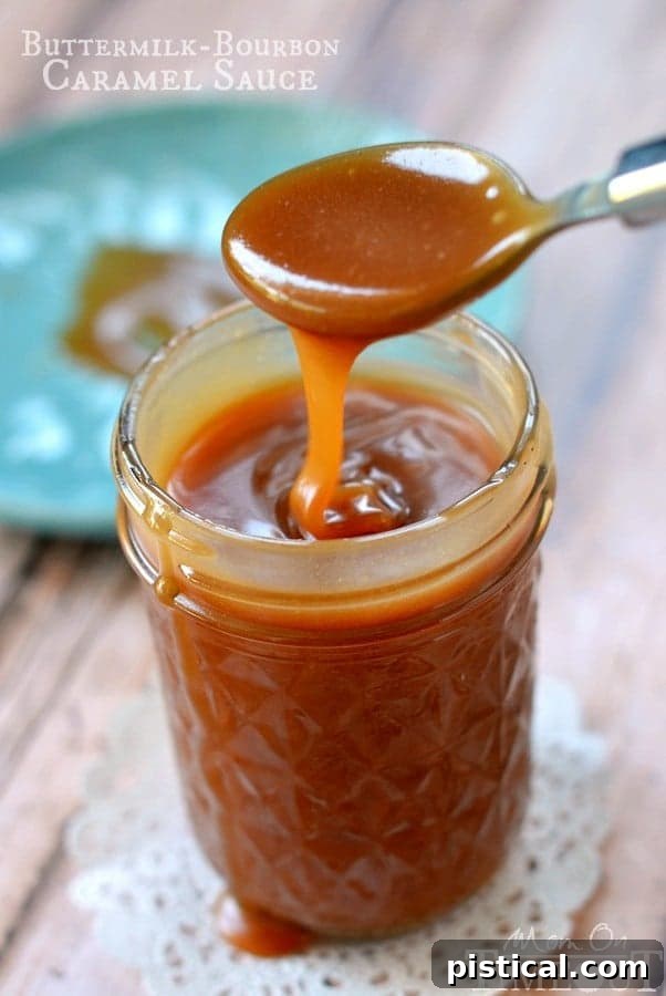 Velvet Bourbon Buttermilk Caramel 3 Close-up of golden Buttermilk Bourbon Caramel Sauce in a glass jar, demonstrating its perfect texture. MomOnTimeout.com