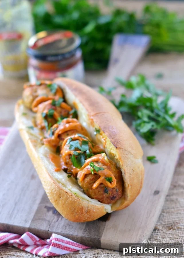 Tuscan Chicken Meatball Sandwiches served open-faced, ready to be enjoyed.