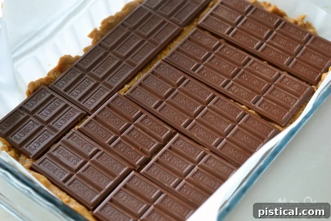 Reese's Peanut Butter S'mores Oatmeal Cookie Bars with rich peanut butter cookie dough
