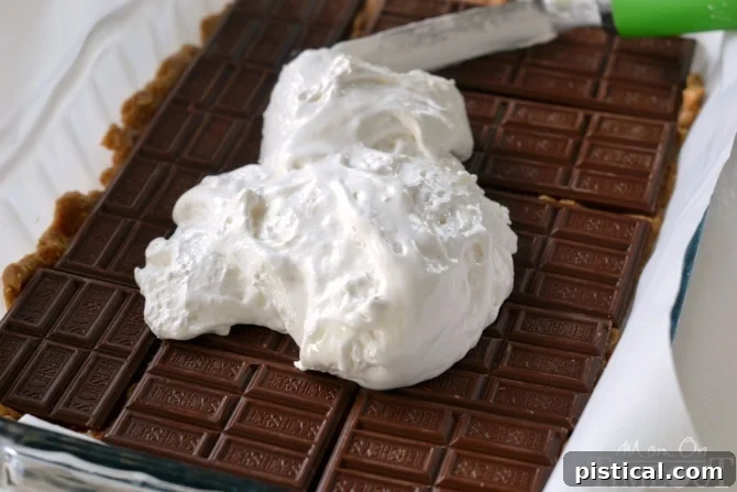 Reese's Peanut Butter S'mores Oatmeal Cookie Bars with marshmallow fluff layer