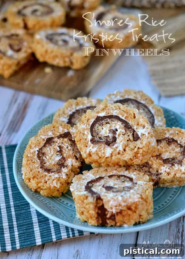 Smores Swirl Krispie Pinwheels 3 Close-up of S'mores Rice Krispies Treats Pinwheels, showcasing the intricate layers of marshmallow, chocolate, and graham cracker cereal.