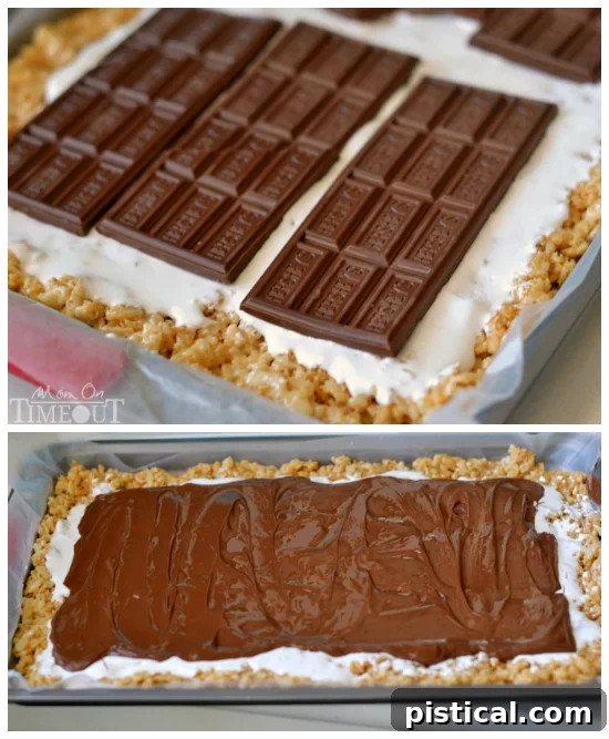 Smores Swirl Krispie Pinwheels 6 Detailed shot of spreading marshmallow creme and gently melted Hershey's chocolate bars over the Rice Krispies base for S'mores Pinwheels.