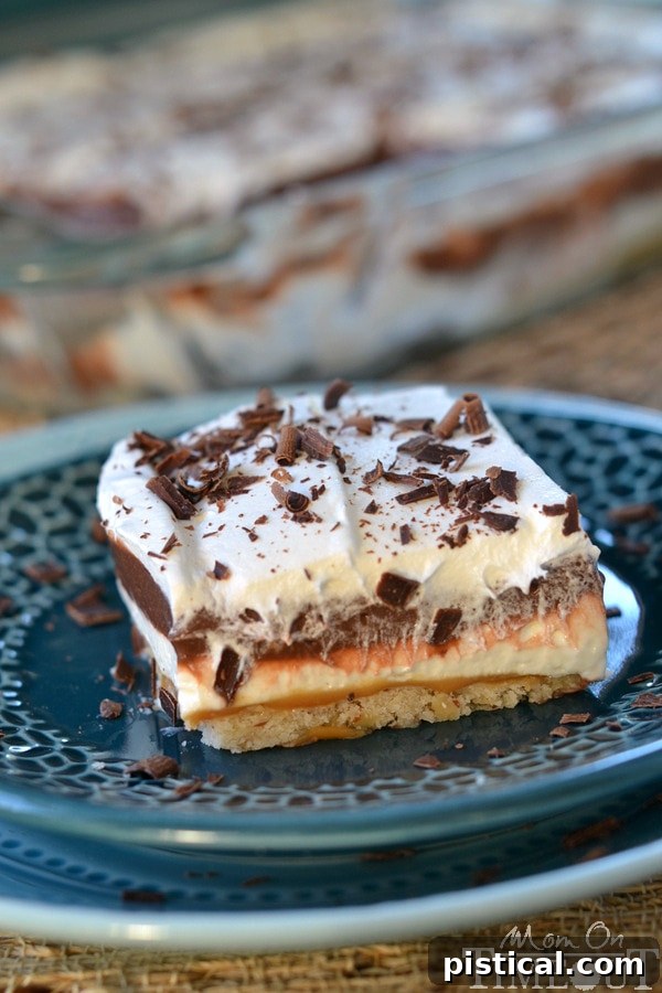 Golden Caramel Chocolate Dream 3 Discover the Secret Behind the Best Chocolate Caramel 5-Layer Dessert! Starting with Grandma's classic, we added a luscious caramel layer to elevate this already beloved treat. MomOnTimeout.com #dessertgoals #sweettooth #bakinginspiration