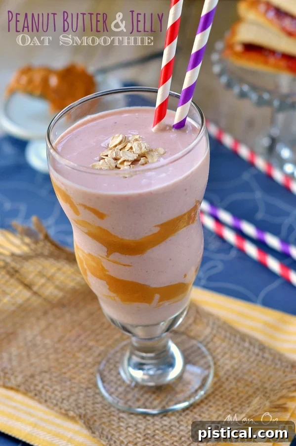 Peanut Butter and Jelly Oat Smoothie with Greek yogurt and oats in a tall glass, perfect for a hearty breakfast or snack.