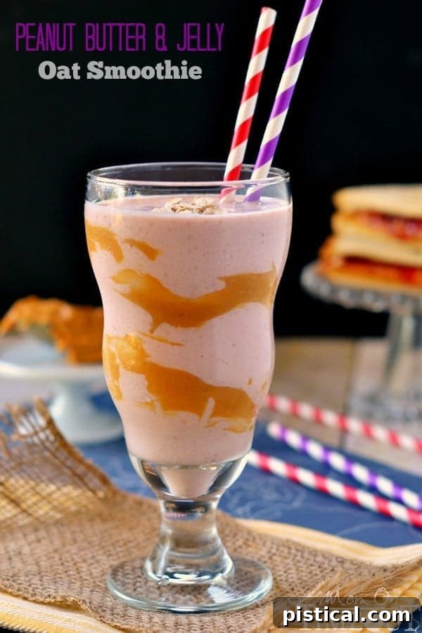 Close-up of a vibrant Peanut Butter and Jelly Oat Smoothie in a glass, showing its creamy texture and rich color.