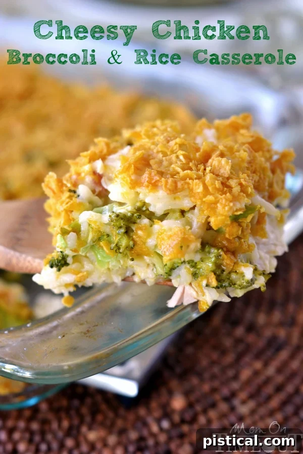 Serving a portion of creamy Chicken Broccoli Rice Casserole, topped with melted cheese and a crispy golden crust.