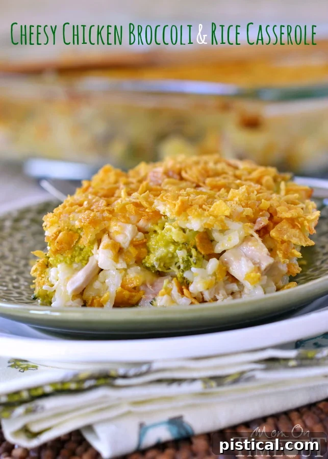 A generous serving of Cheesy Chicken Broccoli Rice Casserole on a white plate, showcasing the creamy texture and melted cheese.