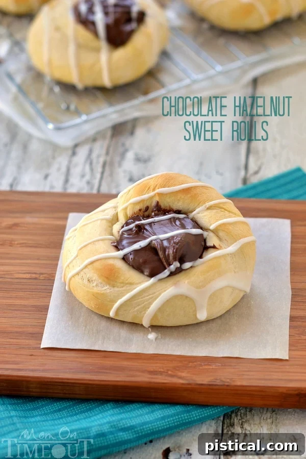 Decadent Chocolate Hazelnut Sweet Rolls fresh from the oven, drizzled with glaze, ready to be enjoyed as a quick and easy breakfast or dessert.