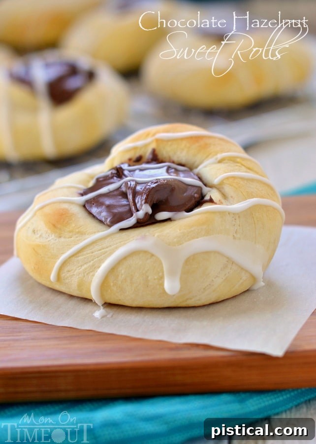 An inviting close-up shot of a single Chocolate Hazelnut Sweet Roll, topped with a generous amount of hazelnut glaze and ready to be enjoyed.