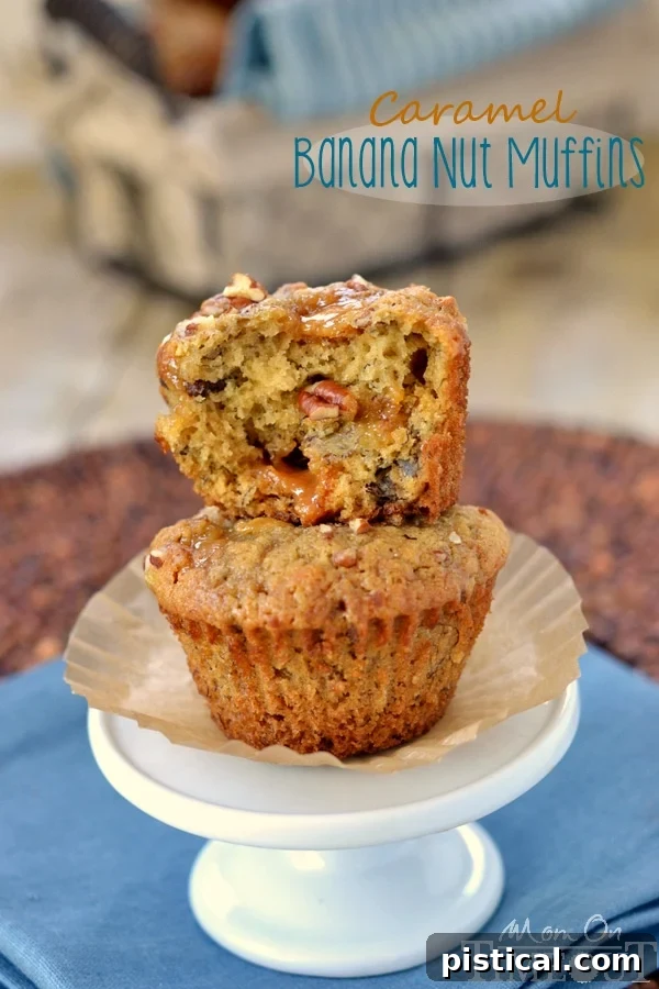 Decadent Caramel Banana Nut Muffins 2 Two golden-brown caramel banana nut muffins on a small cupcake stand, one torn in half to show the moist interior and gooey caramel pockets.