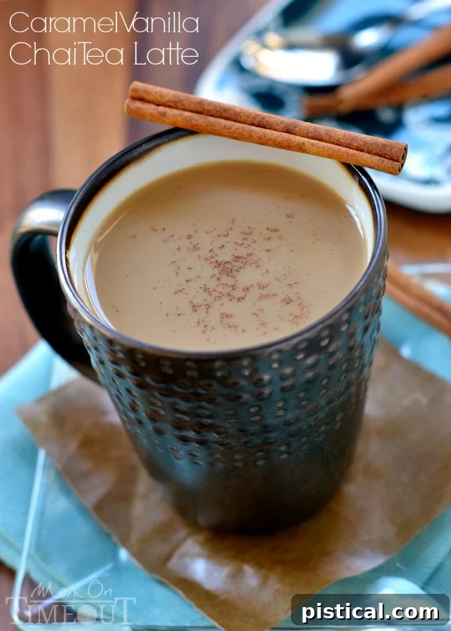 Close-up of a Caramel Vanilla Chai Tea Latte, featuring a creamy texture, distinct caramel swirls, and a sprinkle of spices on top. The perfect warm drink.