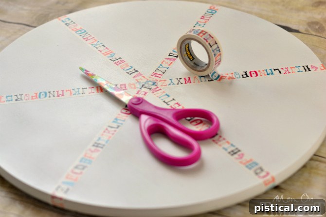 Revolving Homework Caddy 5 Applying washi tape to divide sections on a DIY homework station turntable
