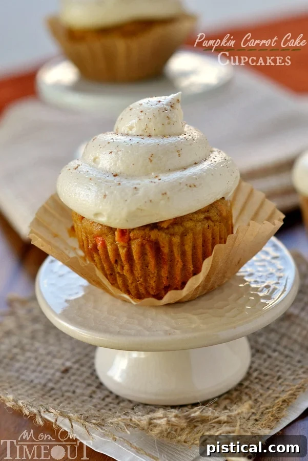 Pumpkin Carrot Cake Cupcakes with Maple Cream Cheese Frosting - the cupcakes you need to make this Fall! | MomOnTimeout.com | #dessert #recipe #pumpkin #maple #cupcakes