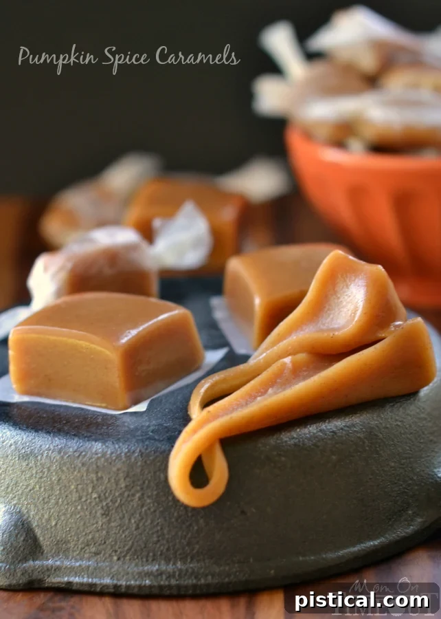 A block of Pumpkin Spice Caramels, showing the gooey, soft interior and speckles of spice.
