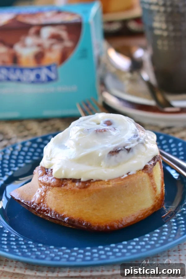 Four mugs filled with Slow Cooker Spiced White Hot Chocolate, topped with a generous swirl of whipped cream and a sprinkle of cinnamon, ready to serve.