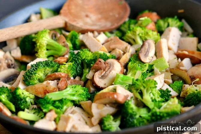 Close-up of the delicious cheesy chicken and broccoli puff filling, showcasing the savory ingredients before baking.
