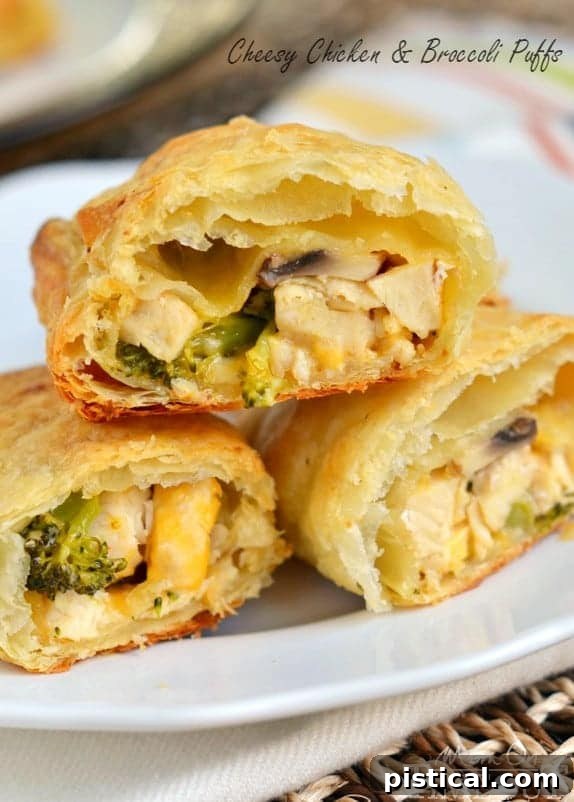 Crispy, golden Cheesy Chicken and Broccoli Puffs, ready to be served as an effortless and family-pleasing dinner. Made with rotisserie chicken and puff pastry.