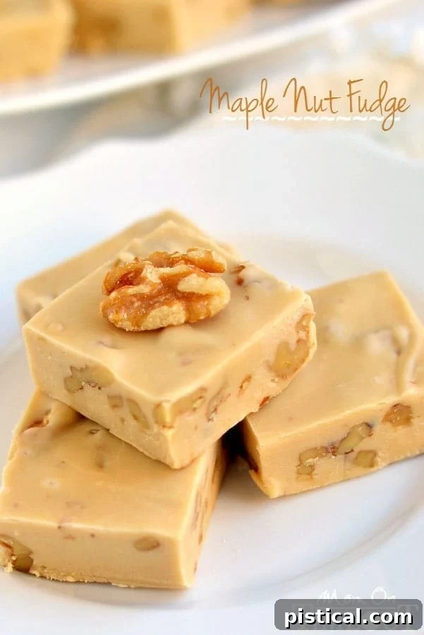 Maple Nut Bliss 2 A delectable block of creamy maple nut fudge, showcasing its smooth texture and the visible crunch of toasted walnuts, ready to be enjoyed.