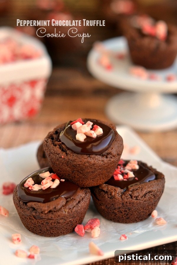 Decadent Peppermint Chocolate Truffle Cups 2 Exquisite Peppermint Chocolate Truffle Cookie Cups filled with peppermint chocolate ganache, a decadent holiday dessert. | YourSite.com | #dessert #Christmas #HolidayBaking #Recipe