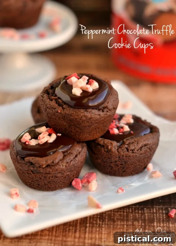 Decadent Peppermint Chocolate Truffle Cups 5 A festive display of Peppermint Chocolate Truffle Cookie Cups, perfect for Christmas gatherings and holiday dessert tables. | YourSite.com | #HolidayDesserts #PeppermintLove