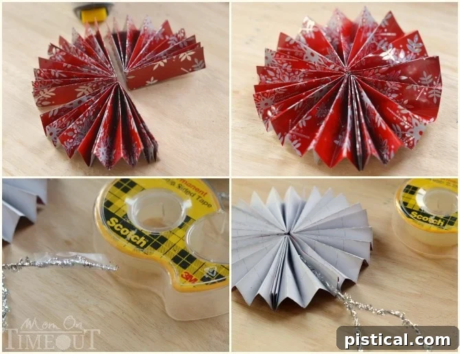 Applying Scotch double-sided tape to the inner flap of a folded wrapping paper fan and securing it to form one section of the medallion.