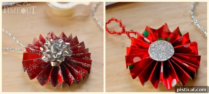 A completed Gift Wrap Medallion Ornament with a red mini bow securely attached to its center, showcasing the intricate folds and festive design.