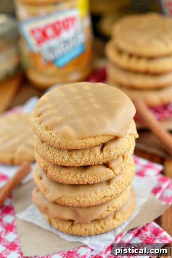 Soft and chewy peanut butter cookies ready for a delicious glaze Close-up of freshly baked peanut butter cookies cooling on parchment paper