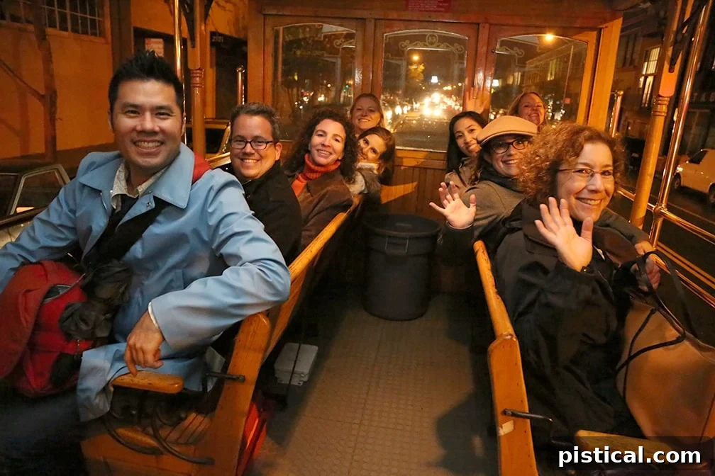 Chef Rick Bayless and attendees on an open-air trolley car in San Francisco, part of the Negra Modelo food tour.
