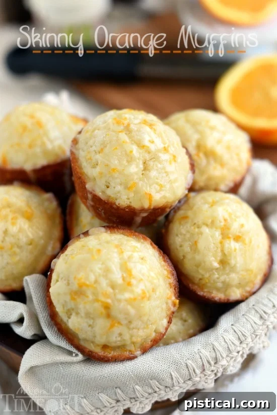 These Skinny Orange Muffins are made with Greek yogurt and plenty of orange zest for a terrific, bright orange flavor! So tender and moist, these muffins are a great way to start to your day! | MomOnTimeout.com | #breakfast #brunch #muffin #recipe #orange