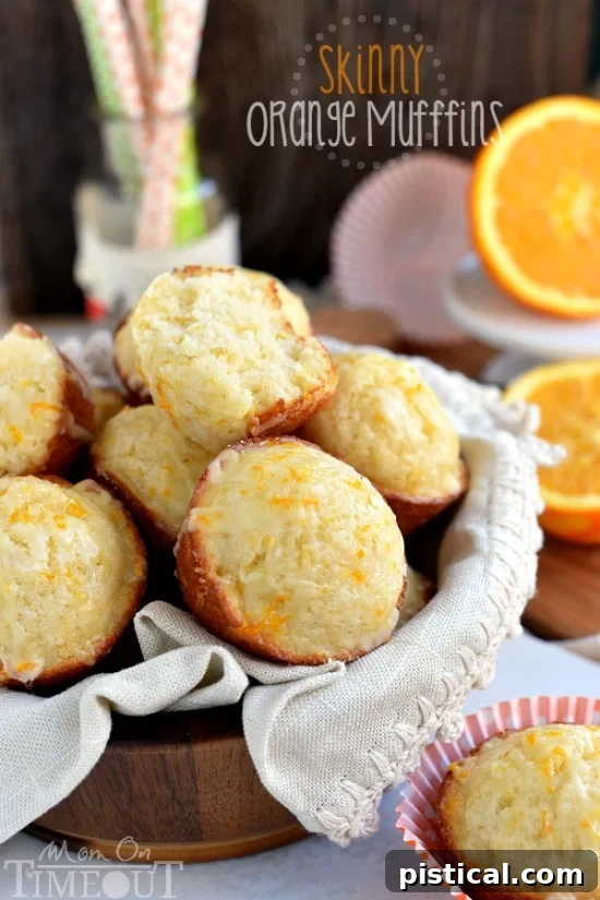 These Skinny Orange Muffins are made with Greek yogurt and plenty of orange zest for a terrific, bright orange flavor! So tender and moist, these muffins are a great way to start to your day! | MomOnTimeout.com | #breakfast #brunch #muffin #recipe #orange