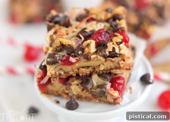 Cherry Coconut Magic Bars! If you love cherries, chocolate, and coconut together like I do - prepare for true bliss! | MomOnTimeout.com | #recipe #cherry #coconut #dessert #chocolate
