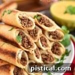 Baked Beef Flautas with Queso Dip