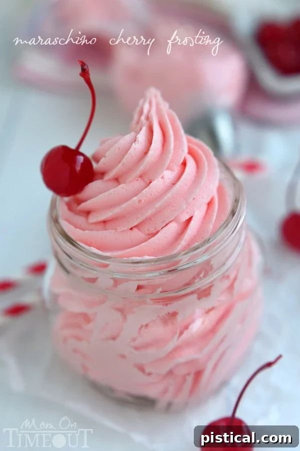 Close-up of a bowl of homemade Maraschino Cherry Frosting, displaying its smooth texture and light pink color, ready to be spread.