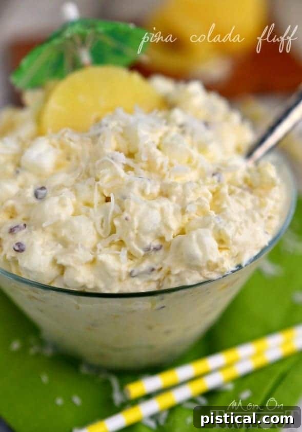 Pina Colada Cloud 4 Bring that tropical feeling home with Pina Colada Fluff! An incredibly easy and delicious dessert salad! MomOnTimeout.com | #recipe #salad #dessert #pineapple #coconut