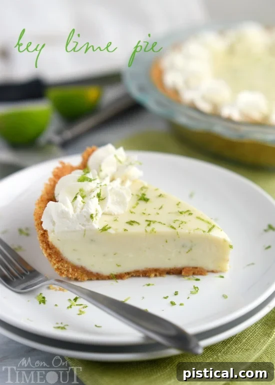 Easy Key Lime Pie: A Delightful Dessert A stunning side view of a homemade Key Lime Pie, showcasing the crisp graham cracker crust, the creamy lime filling, and a light dusting of zest.