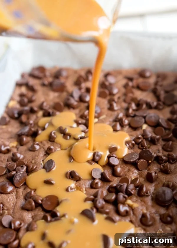 Ultimate German Chocolate Caramel Brownies 4 A tray of freshly baked German Chocolate Caramel Brownies, showing the delectable caramel swirl.