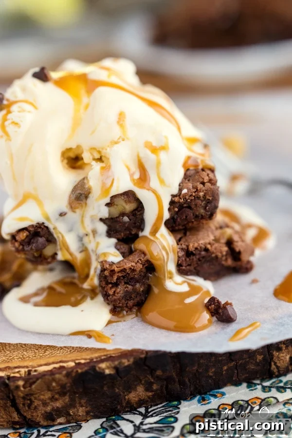 Ultimate German Chocolate Caramel Brownies 5 Plated German Chocolate Caramel Brownie with a scoop of ice cream and caramel drizzle.