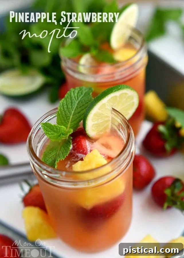 Pineapple Strawberry Mojito -Perfectly cool, sweet, and SO refreshing, this fruit-infused cocktail has it all! So easy to make and pretty darn easy on the eyes! (Can be made virgin!) | MomOnTimeout.com