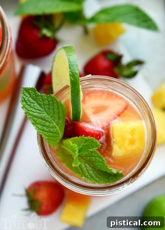 Perfectly cool, sweet, and SO refreshing, this fruit-infused cocktail has it all! | MomOnTimeout.com
