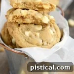 A baked brown butter white chocolate macadamia nut cookie.