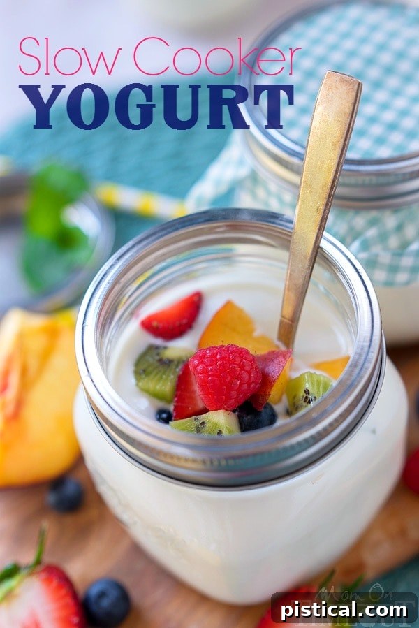 Delicious homemade slow cooker yogurt topped with fresh fruit and granola.