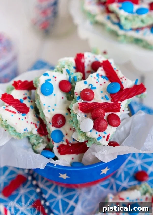 Close-up of the textured Red White and Blue Rice Krispies Treats Bark with a generous topping of colorful sprinkles and candies.
