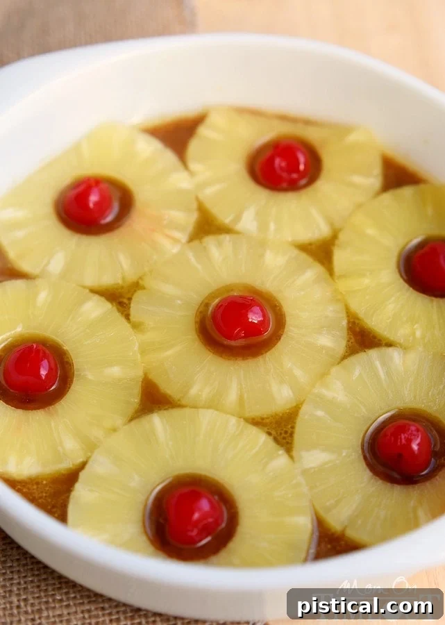 microwave-pineapple-upside-down-cake-pineapples arranged in a round cake pan