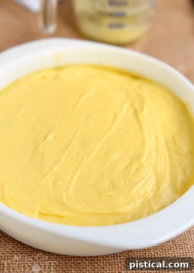 microwave-pineapple-upside-down-cake-batter spread over the pineapples