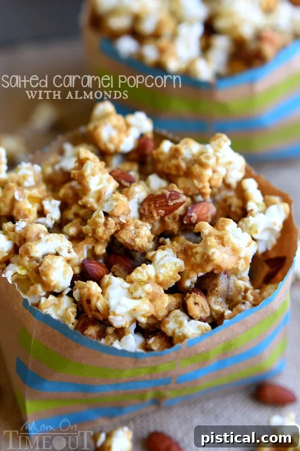 Overhead view of a large bowl of homemade Salted Caramel Popcorn with Almonds, ready for snacking.