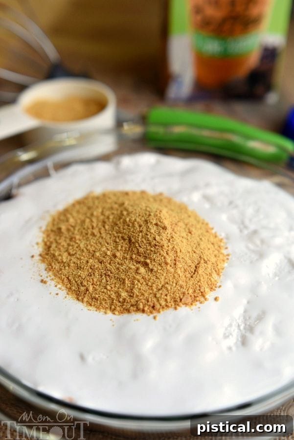 Spreading marshmallow creme over the mocha pudding base