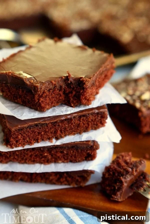 The Ultimate Texas Sheet Cake 5 The legendary Texas Sheet Cake is my go-to cake recipe to feed a crowd! Easy as can be, this cake boasts intense chocolate flavor and richness and can be made with or without nuts - dig in! // Mom On Timeout #cake #chocolate #texas #sheetcake #recipe #desserts #baking #recipes