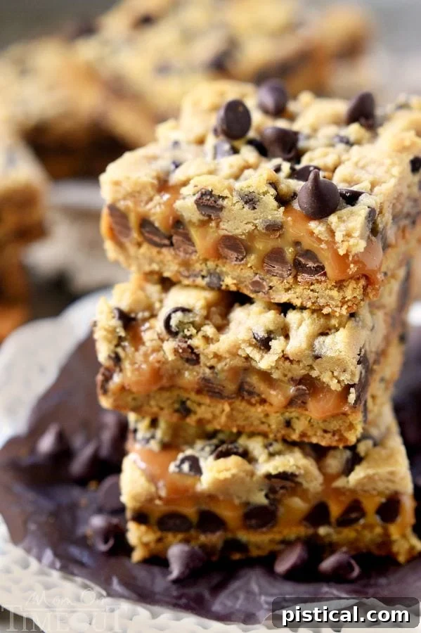 Delicious Easy Carmelitas recipe bars, perfectly cut and arranged to show off their gooey caramel and chocolate layers.